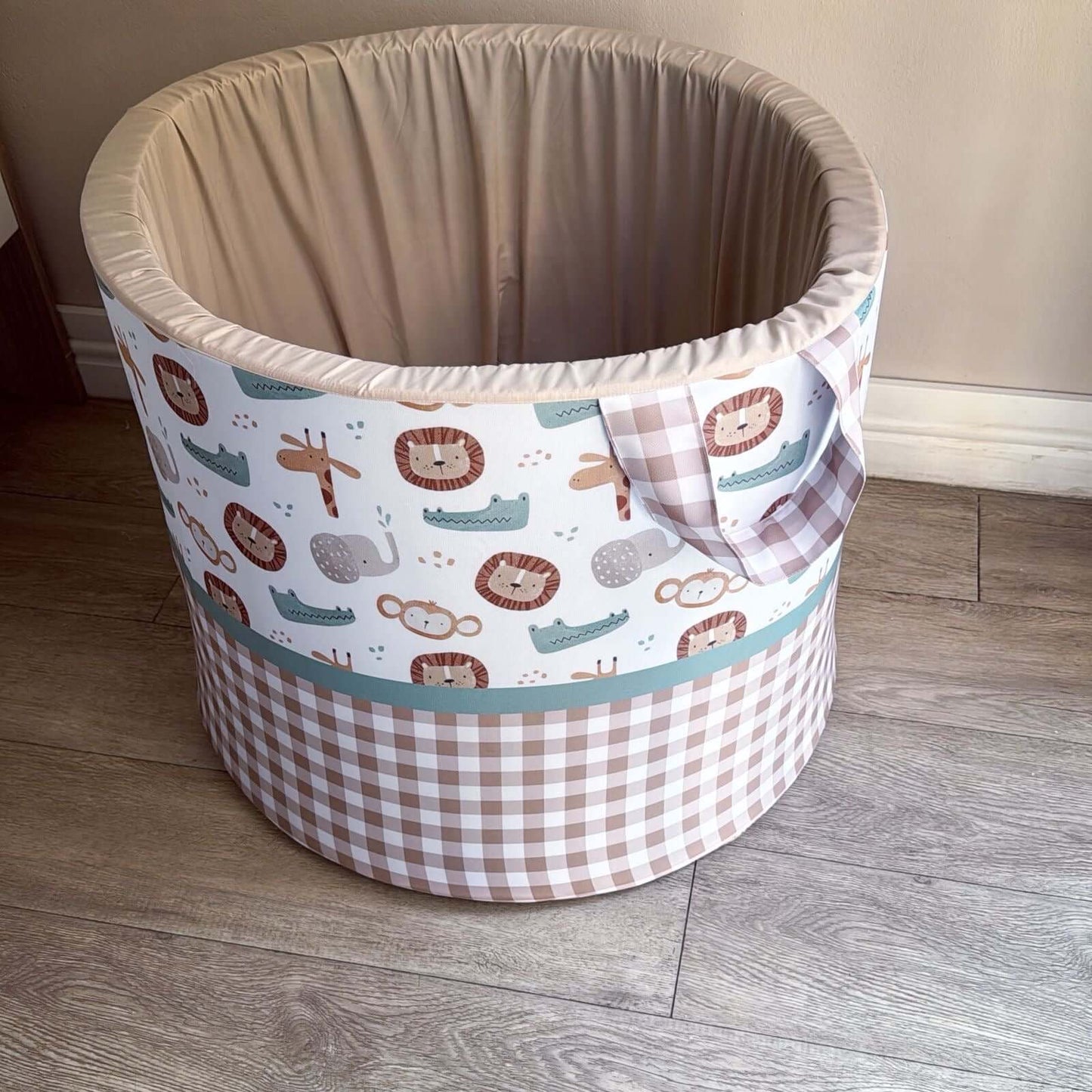 Laundry Basket storage bin with animal pattern on a wooden floor