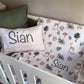 Crib with patterned sheet and pillow with 'Sian' printed on it | Baby Essentials | All Baby Products | Soft Spot Kids | South Africa
