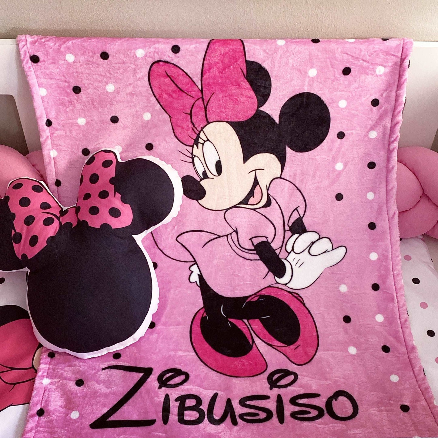 Pink blanket with Minnie Mouse design and 'Zibusiso' branding