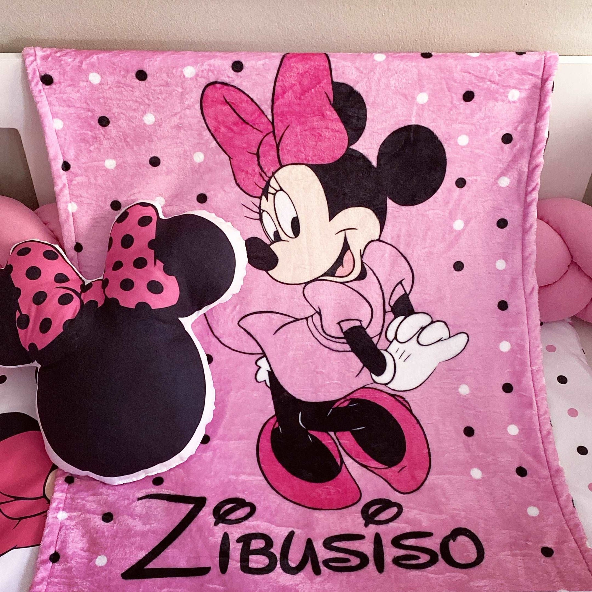 Pink blanket with Minnie Mouse design and 'Zibusiso' branding