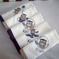 Set of towels with embroidered teddy bear designs and the name 'Kian' on a light gray background. | Baby Burp Cloths & Towels | Soft Spot Kids | South Africa