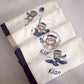 Folded towel with embroidered teddy bears and names on a light gray background | Baby Burp Cloths & Towels | Soft Spot Kids | South Africa