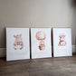 Three wall art prints featuring cartoon hippopotamuses with motivational phrases on a wooden floor. | All Nursery Sets | Baby Bedding Sets South Africa | Soft Spot Kids | South Africa