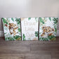 Three canvas prints with lion cub illustrations and text on a wooden floor. | All Nursery Sets | Baby Bedding Sets South Africa | Soft Spot Kids | South Africa
