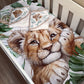 Crib with lion-themed bedding and towels on a wooden floor. | All Nursery Sets | Baby Bedding Sets South Africa | Soft Spot Kids | South Africa