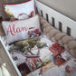 A personalized baby crib bedding set featuring a farm-themed print with a red tractor, barn, trees, and a cow, complete with a matching braided bumper and a custom name pillow reading 'Alan'. | All Nursery Sets | Baby Bedding Sets South Africa | Soft Spot Kids | South Africa