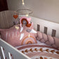 Baby crib with pink pillow, heart-shaped mobile, and braided bumper | All Nursery Sets | Baby Bedding Sets South Africa | Soft Spot Kids | South Africa