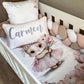 A cot bedding set featuring a pink bunny design, with a personalized name pillow, a duvet cover, and a fitted sheet, arranged on a white cot. | All Nursery Sets | Baby Bedding Sets South Africa | Soft Spot Kids | South Africa