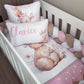 A white crib bedding set styled in a nursery, featuring a watercolor bunny design, a pink polka-dot sheet, a pink and white striped bumper, a chunky braided cord, and two matching pillows including one with the name 'Clarice' in pink script. | All Nursery Sets | Baby Bedding Sets South Africa | Soft Spot Kids | South Africa