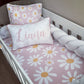 Children's crib with pink daisy pattern bedding and a pillow with 'Liana' on it. | All Nursery Sets | Baby Bedding Sets South Africa | Soft Spot Kids | South Africa