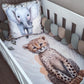 A white crib with a watercolor print bedding set featuring a cheetah cub on the mattress and a matching elephant pillow, surrounded by a multi-colored chunky bumper. | All Nursery Sets | Baby Bedding Sets South Africa | Soft Spot Kids | South Africa