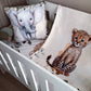 A baby bedding set in a white crib, featuring a cream-colored blanket with a watercolor cheetah print and a matching elephant pillow. | All Nursery Sets | Baby Bedding Sets South Africa | Soft Spot Kids | South Africa