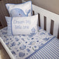 A blue and white baby bedding set styled in a white wooden crib, featuring a duvet cover with a playful sea-creature print, a striped pillow, and a whale-print pillow. | All Nursery Sets | Baby Bedding Sets South Africa | Soft Spot Kids | South Africa