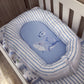 A baby bassinet cushion set with a light blue and white striped fabric border and a matching blue insert featuring a shark and whale illustration, shown inside a white crib. | All Nursery Sets | Baby Bedding Sets South Africa | Soft Spot Kids | South Africa