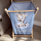 Children's laundry basket with a giraffe design and 'Ruhard' branding on a wooden stand. | All Nursery Sets | Baby Bedding Sets South Africa | Soft Spot Kids | South Africa