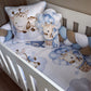 Baby crib with blue and brown giraffe-themed bedding and pillows. | All Nursery Sets | Baby Bedding Sets South Africa | Soft Spot Kids | South Africa