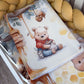 Baby crib sheet with cartoon bear and honey design, surrounded by yellow plush toys. | All Nursery Sets | Baby Bedding Sets South Africa | Soft Spot Kids | South Africa