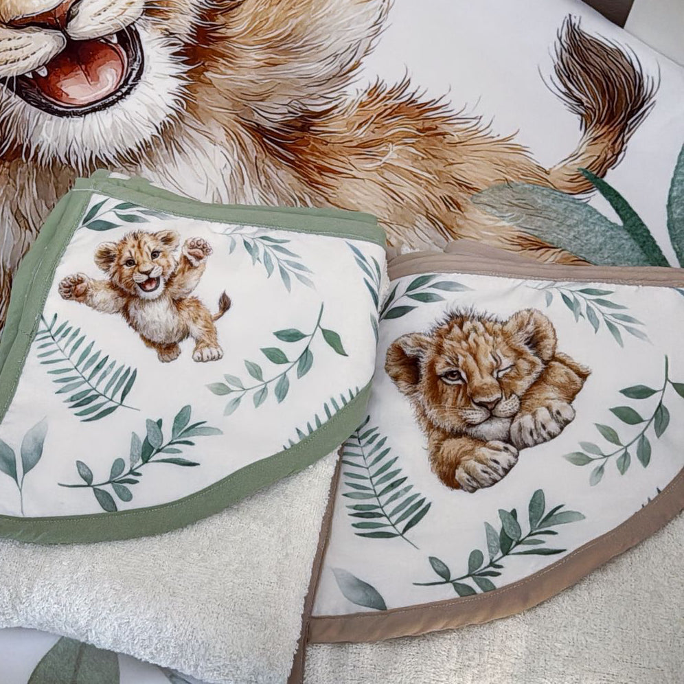 Crib set with lion cub design on a white crib