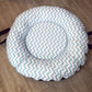Round baby doughnut with blue and white zigzag pattern on a wooden floor | Baby Doughnut Cushions | Infant Support Pillows | Soft Spot Kids | South Africa