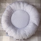 Round gray and white striped cushion on a textured surface | Baby Doughnut Cushions | Infant Support Pillows | Soft Spot Kids | South Africa
