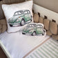 Two pillows with green car designs on a crib with beige bedding. | All Nursery Sets | Baby Bedding Sets South Africa | Soft Spot Kids | South Africa
