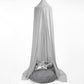 A grey hanging tent canopy with a hoop diameter of 45cm, displayed outdoors. It appears to be made of a stretchy fabric and is draped elegantly with one side featuring a metallic ornament. | Baby Canopy Nets | Cot Mosquito Nets | Soft Spot Kids | South Africa