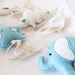 A close-up of soft baby plush toys on a white fabric background, including a light blue elephant, a white cloud ornament, and a pale blue star-shaped toy with cream ribbons. | Baby Essentials | All Baby Products | Soft Spot Kids | South Africa