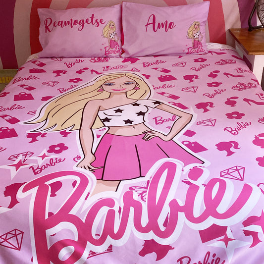 Barbie-themed bedding set with character and text on a pink background