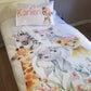 A toddler bedding set with a pink safari theme, featuring cartoonish animal characters such as a giraffe, elephant, and others, along with floral designs, presented on a bed with a child's name 'Karlien' on a pillowcase. | Baby Essentials | All Baby Products | Soft Spot Kids | South Africa