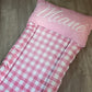 Pink checkered blanket with 'Miane' printed on a wooden floor | Baby Essentials | All Baby Products | Soft Spot Kids | South Africa