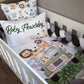 Crib with safari-themed bedding, pillows, and bumper