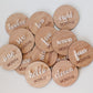 Wooden discs with milestone text on a light background | Baby Essentials | All Baby Products | Soft Spot Kids | South Africa