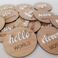Wooden round milestone markers with numbers and phrases on a light background | Baby Essentials | All Baby Products | Soft Spot Kids | South Africa
