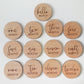 Wooden circular markers with milestone text on a light gray background | Baby Essentials | All Baby Products | Soft Spot Kids | South Africa