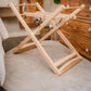 Wooden folding laundry rack on a carpeted floor with wooden furniture in the background | Baby Essentials | All Baby Products | Soft Spot Kids | South Africa