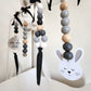 Easter-themed nursery wall hanging with wooden bead garlands, black ribbon bows, a white bunny face cutout, and a round sign that reads 'Every little thing is alright!'. | Baby Essentials | All Baby Products | Soft Spot Kids | South Africa