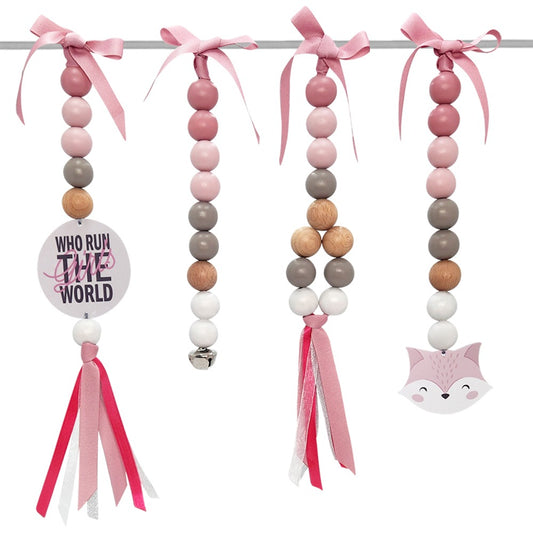 Three pink beaded hanging garlands with pink ribbon bows, tassels, a small bell, and a fox face charm, displayed on a white background.