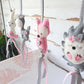 A set of handmade felt animal hanging ornaments, including a pink fox, a white bunny, and a gray hedgehog, decorated with pink and gray ribbons against a rustic white wooden background. | Baby Essentials | All Baby Products | Soft Spot Kids | South Africa